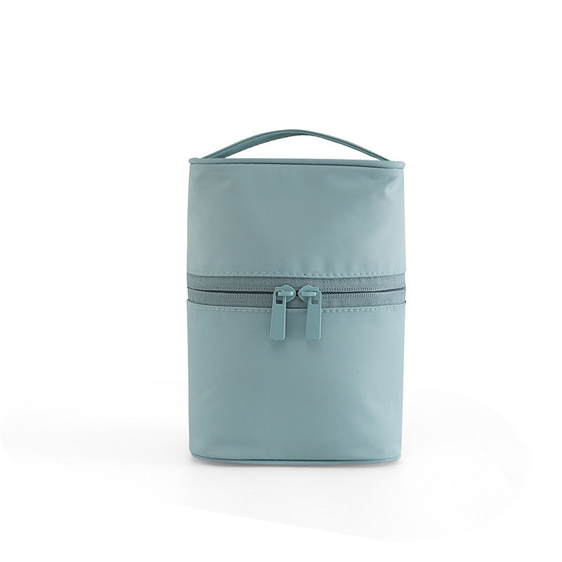 Light blue toiletry bag with a zipper on a white background