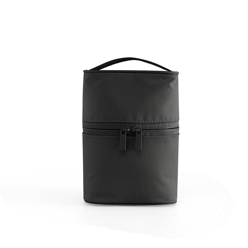 Black insulated lunch bag with a handle on a white background